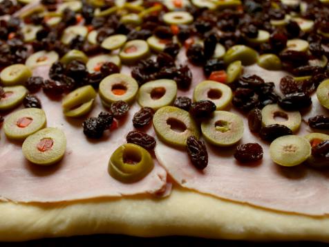 Venezuelan cuisine: Christmas loaf pan de jamon close-up. Vertical