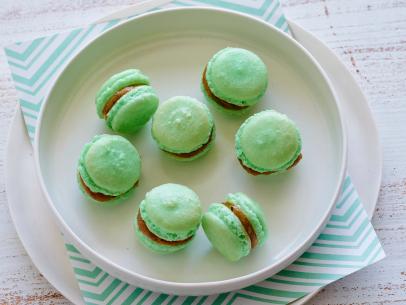 PISTACHIO MACARONS
Julia Baker
Cooking Channel
Raw Pistachios, Sugar, Almond Flour, Vegetable Oil, Unsalted Butter, Almond Paste, Almond
Extract, Powdered Sugar, Fine Salt, Vanilla Extract, Green Food Coloring, Eggs