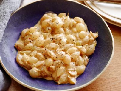 CREAMED PEARL ONIONS
Tyler Florence
Tyler’s Ultimate/Ultimate Holiday Table
Food Network
Frozen Pearl Onions, Unsalted Butter, Heavy Cream, Kosher Salt, Pepper