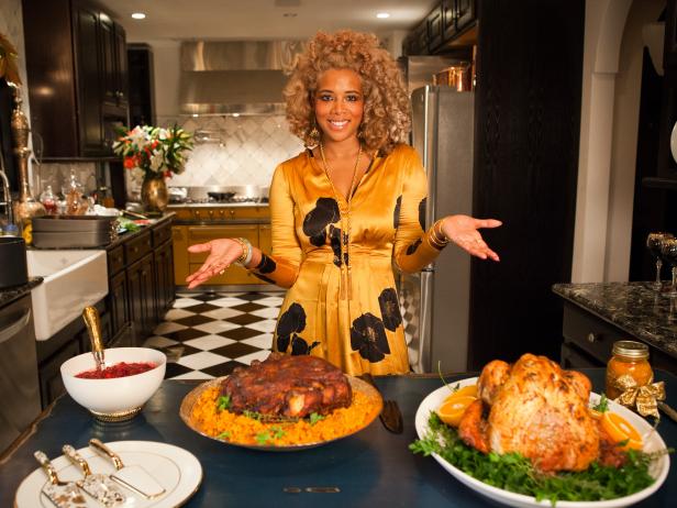 Host and Chef Kelis Rogers shows off the Puerto Rican Pork Pernil, Pineapple-Saffron Larded Turkey, and Mandarin Cranberry Sauce for her holiday dinner party, as seen on Cooking Channel's Holiday Feast with Kelis, Special.