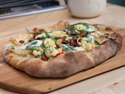 Tarte Flambe with Herbed Creme Fraiche, Aged Cheddar, Caramelized Vidalia, Double Smoked Bacon, Softly Scrambled Eggs and Goat Cheese
