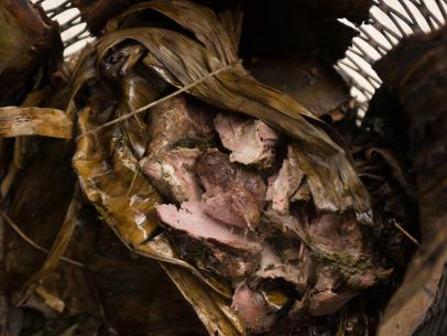 Lamb barbacoa, cooked wrapped in maguey leaves, as seen on Cooking Channel's Man Fire Food, Season 3.