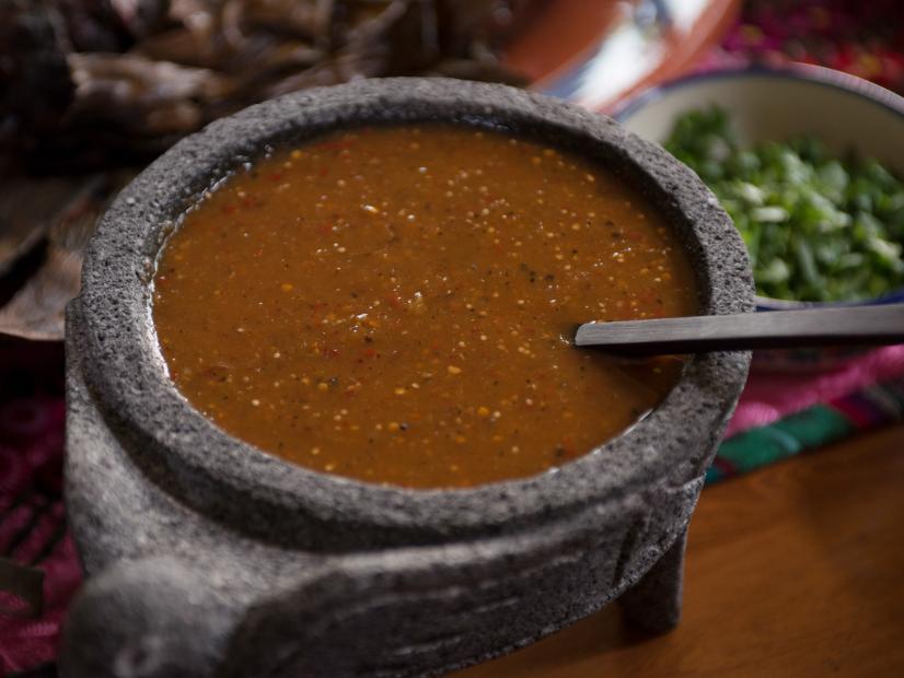 A molcajete filled with salsa is presented at chef Johnny Hernandez's restaurant, Casa Hernan, as seen on Cooking Channel's Man Fire Food, Season 3.