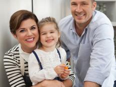 Host Tiffani Thiessen poses for a photo with daughter Harper, and husband Brady Smith, as seen on Cooking Channel's Dinner at Tiffani's, Season 1.