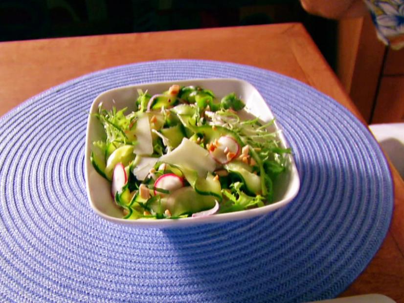 A bowl of zucchini ribbon salad is served.