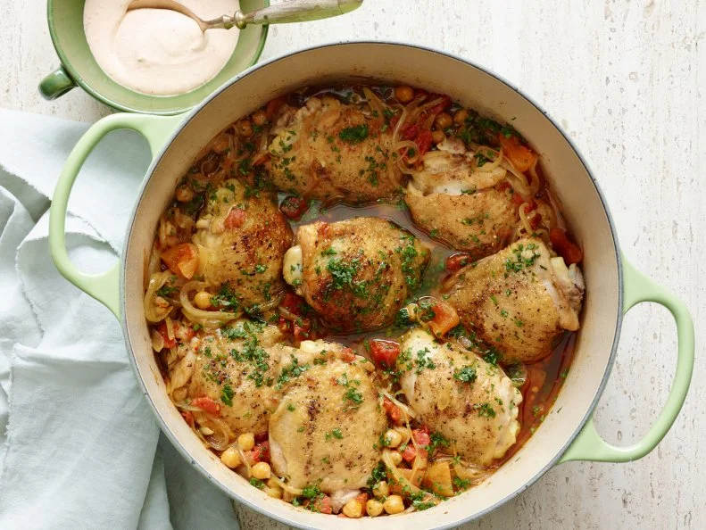CHICKEN AND CHICKPEA TAGINE WITH APRICOTS AND HARISSA SAUCE
Bobby Flay
Cooking Channel
Canola Oil, Chicken Thighs, Salt, Black Pepper, Olive Oil, Yellow Onion, Garlic, Ras AlHanut,
Saffron, Cinnamon Stick, Diced Tomatoes, Chickpeas, Dried Apricots, Harissa Sauce, Flatleaf
Parsley, Cilantro
