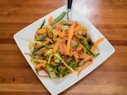 Kelsey Nixon's Pickled Cucumber Rainbow Carrot Slaw as seen on Cooking Channel’s Kelsey’s Homemade, Season 1.