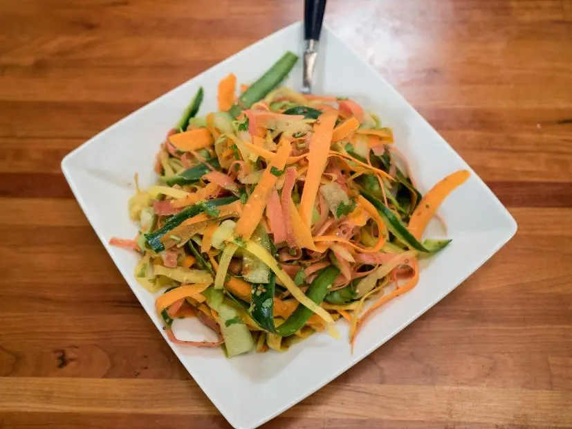 Kelsey Nixon's Pickled Cucumber Rainbow Carrot Slaw as seen on Cooking Channel’s Kelsey’s Homemade, Season 1.