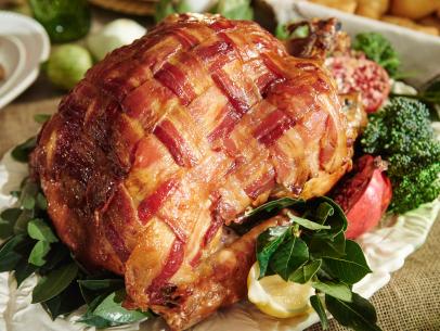 Host Tori Spelling and Dean McDermott's dish, Maple-Bacon Latticed Turkey with Sage Butter, for their Thanksgiving dinner party, as seen on Cooking Channel’s Tori & Dean Specials, Tori & Dean’s Family Thanksgiving.