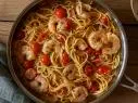 Cory Hardrict adds cherry tomatoes to his garlicky shrimp scampi for a bright finish.
