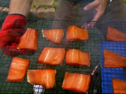 Trout Fillets on a rack being removed from a smoker