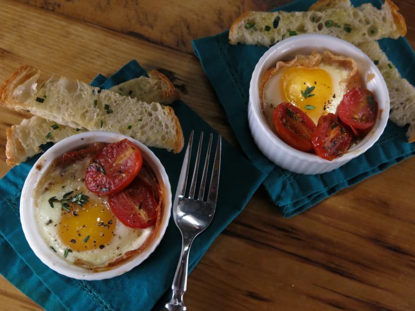 Shirred Eggs with Prosciutto, Candied Tomatoes, ParmesanRosemary Cream