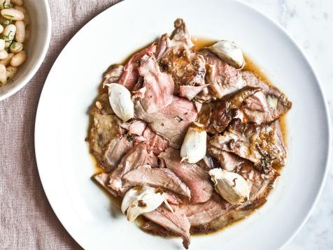 Garlic and Rosemary Studded Leg of Lamb with Cannellini Beans