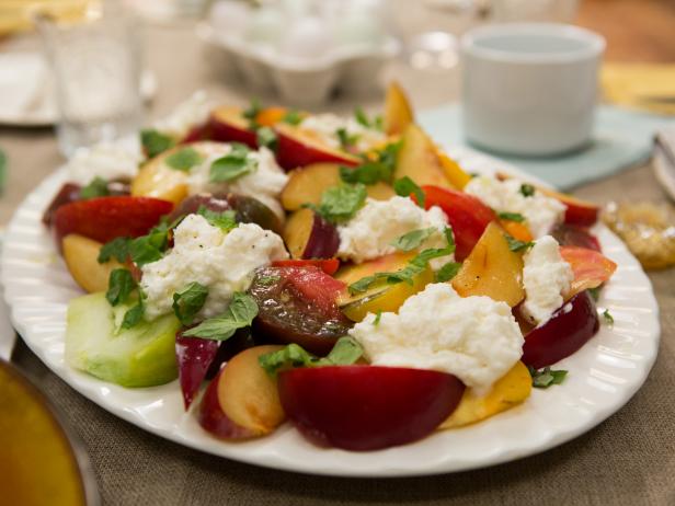 A Plum Caprese Salad on the table for breakfast, as seen on Cooking Channel's Dinner At Tiffani's, Season 1.