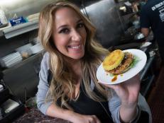 Host Haylie Duff showing off a tasty ramen burger from The Original Ramen Burger in Los Angeles, California as seen on the Cooking Channel's Real Girl's Kitchen, Season 2