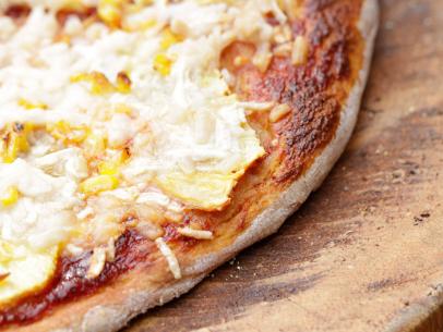Barbecue sauce, pineapple slices and roasted corn add the perfect barbecue twist to this tasty pizza as seen on Cooking Channel's Real Girl's Kitchen with Host Haylie Duff, Season 2.