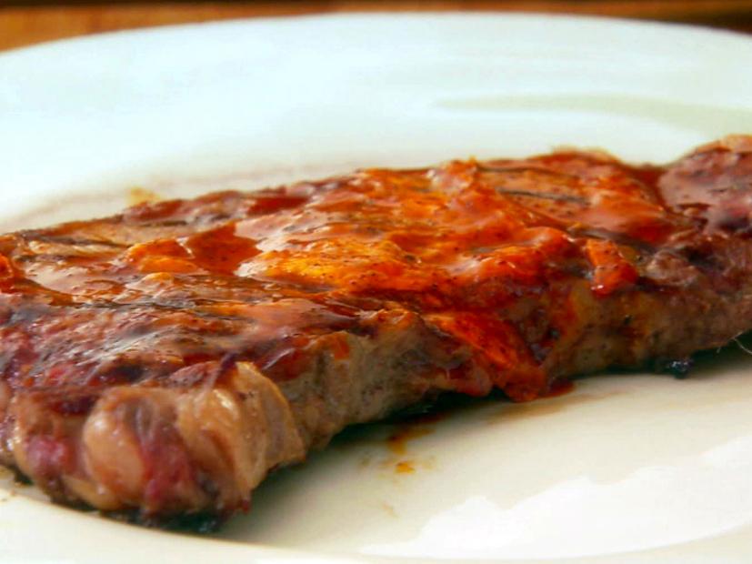 A rib eye is served with a coating of ancho butter.
