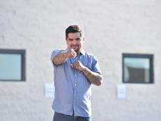 Host Aaron Sanchez poses between taco locations in Las Vegas, Nevada, as seen on Cooking Channel's Taco Trip, Season 2.