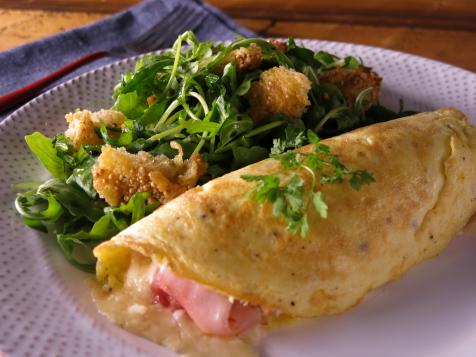 Rolled Omelet with Gruyere, Ham, Arugula and Torn Mustard Croutons