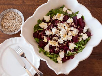 Beet and Goat Cheese Salad with a classic French dijon mustard dressing and sunflower seeds, as featured on UpRooted with Sarah Sharratt.