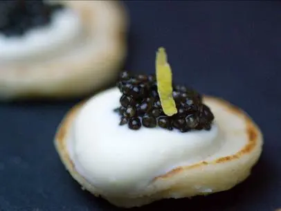 Caviar with Crème Fraiche Blini Recipe prepared by UpRooted host Sarah Sharratt for her French Christmas feast.