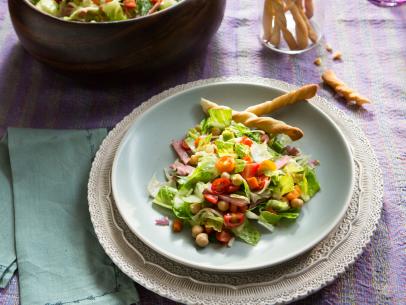 Beauty shot of the Chopped Salad with Roasted Vegetables along with the Italian Breadsticks during Ladies Who Lunch, as seen on Cooking Channel's Dinner at Tiffani's, Season 2.