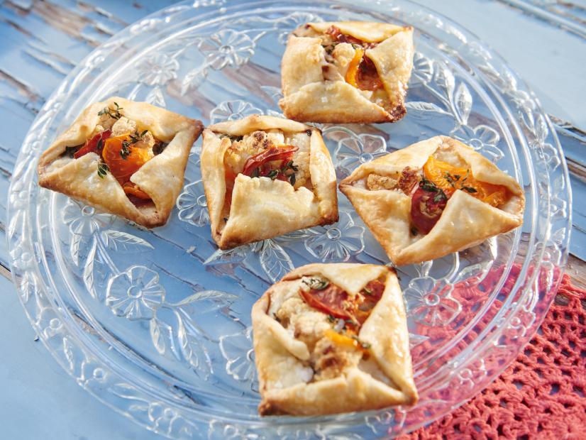 Hosts Tori Spelling and Dean McDermott's dish, Heirloom Tomato, Roasted Cauliflower and Manchego Hand Pies, for their Spring Picnic, as seen on Cooking Channel’s Tori & Dean Specials, Tori & Dean’s Spring Picnic.