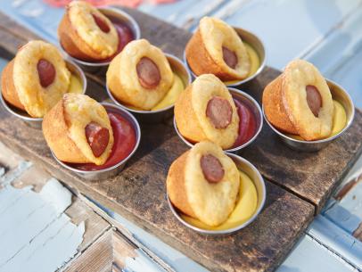 Hosts Tori Spelling and Dean McDermott's dish, Mini Corn-Dog Muffins, for their Spring Picnic, as seen on Cooking Channel’s Tori & Dean Specials, Tori & Dean’s Spring Picnic.