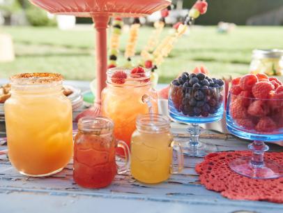 Hosts Tori Spelling and Dean McDermott's drink, Spiked Raspberry, Orange and Almond Sun Tea, for their Spring Picnic, as seen on Cooking Channel’s Tori & Dean Specials, Tori & Dean’s Spring Picnic.
