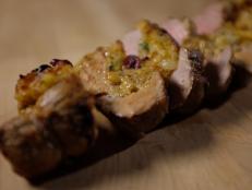 Make stuffed pork tenderloin with cranberry, apple and sharp cheddar inside on Cooking Channel.