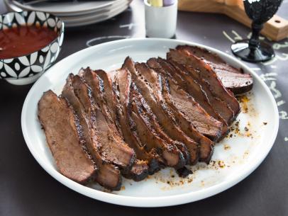 Beauty shot of the Smoked Brisket accompanied by Tiffani’s Barbecue Sauce during Brady's Birthday Bash, as seen on Cooking Channel's Dinner at Tiffani's, Season 2.