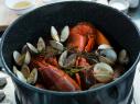Detail of the freshly cooked lobster, clams and vegetables for Lobster Boil during Surf and Turf, as seen on Cooking Channel's Dinner at Tiffani's, Season 2.