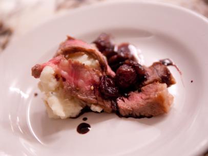 FNS7 Episode 2 Finalist Mary Beth Albright's dish beauty for Star Challenge at Scarpetta.  Ingredients:  Rib eye with roasted grape and wine sauce over potato/parsnip mash.