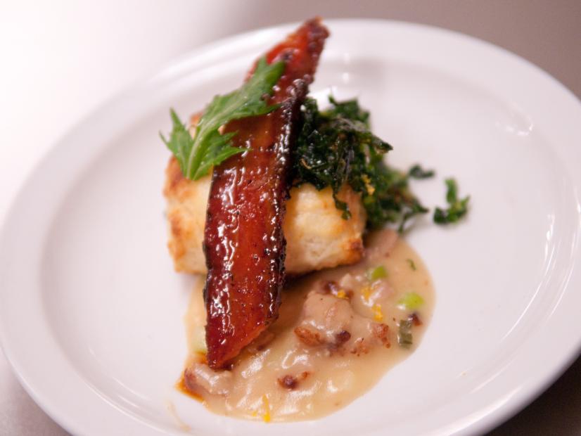 FNS7 Episode 2 Finalist Whitney Chen's dish beauty for Star Challenge at Scarpetta.  Ingredients:  Scallion sesame biscuit on orange ginger sauce/gravy with pork sausage, mushrooms, sauteed mustard greens and bacon Asian glaze.