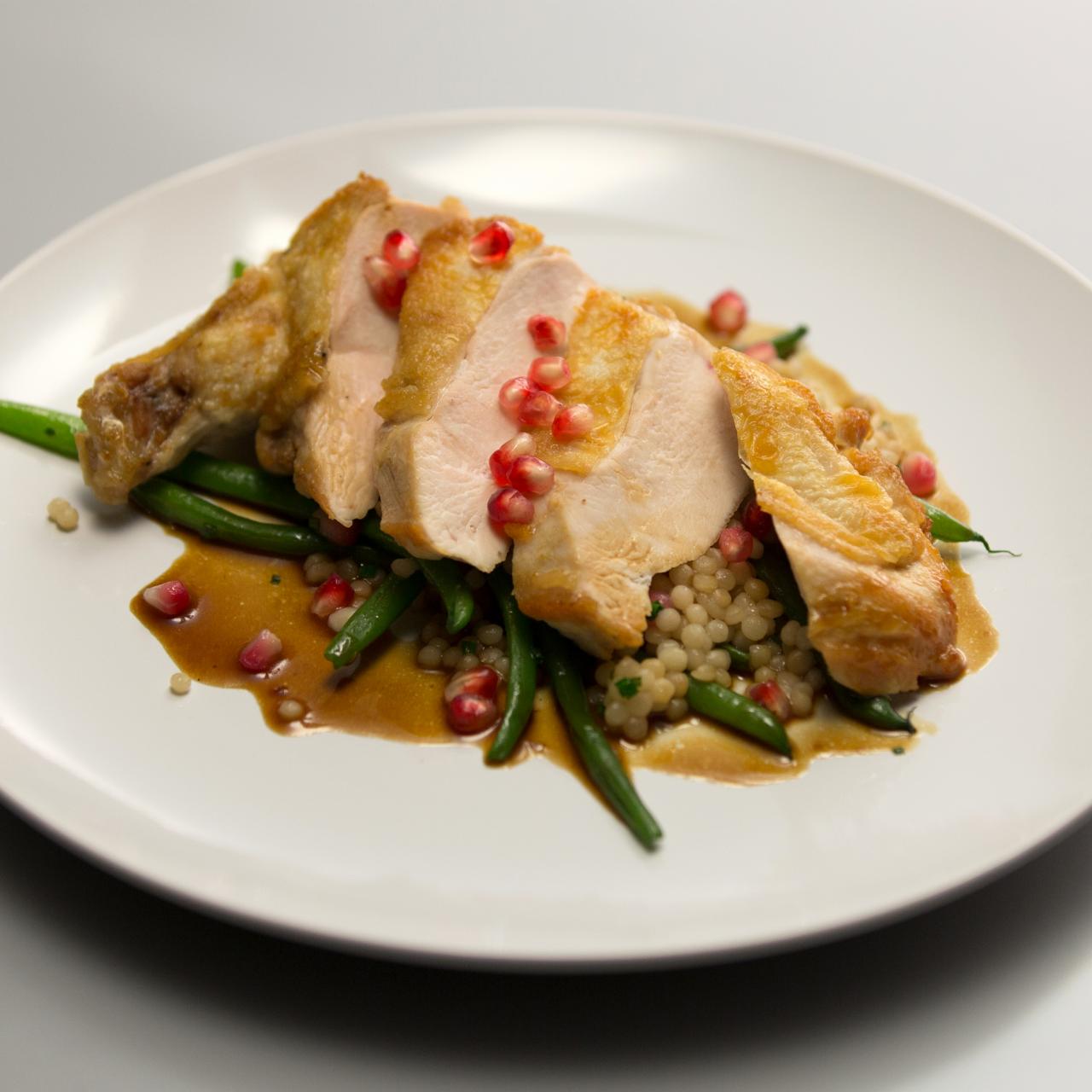 Pan Seared Airline Chicken Breasts with Israeli Couscous Pomegranate and Haricot Verts