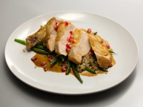 Pan-Seared Airline Chicken Breasts with Israeli Couscous, Pomegranate and Haricot Verts