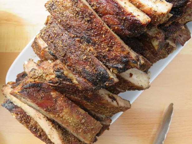 This delicious stack of Open Fire Ribs made by host, Roger Mooking, and Edward Garcia III of The Box Street Social in San Antonio, Texas, as seen on Cooking Channel's Man Fire Food, Season 7.